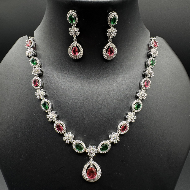 Silver necklace with green/ruby stones