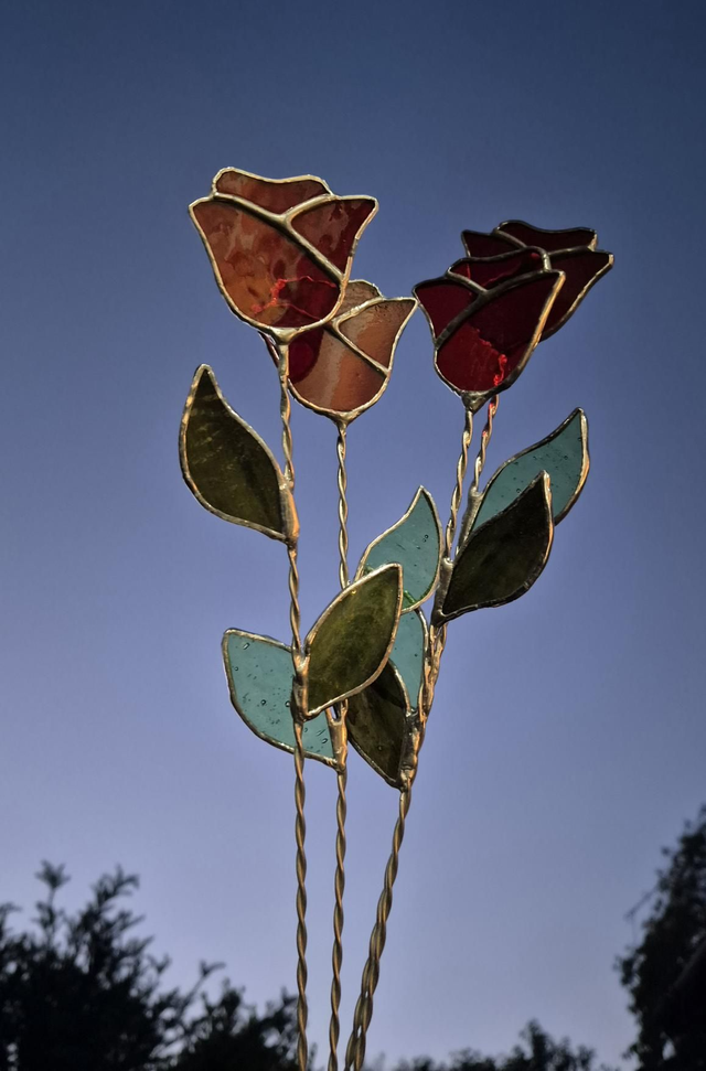 Stained glass roses with leaves on twisted wire stems