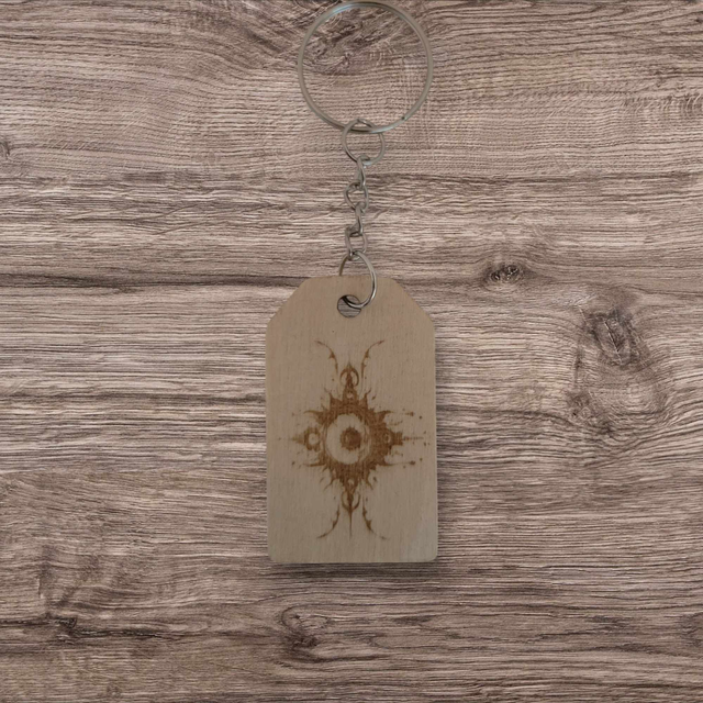 Porte clés artisanal œil en bois.