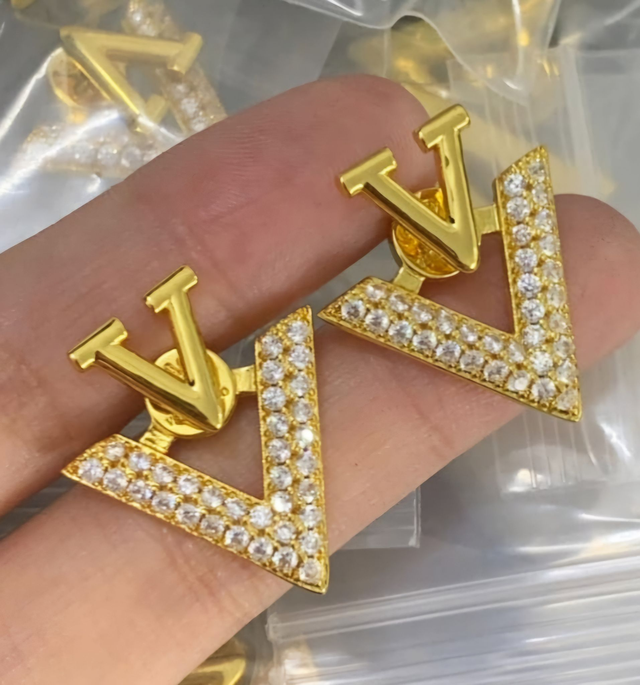 Boucles d'oreilles V doré avec strass