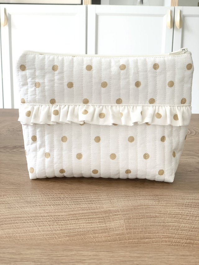 Trousse à maquillage à pois dorés