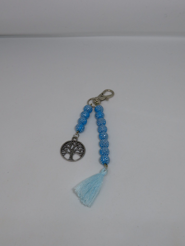 Porte clés bleu et pompon