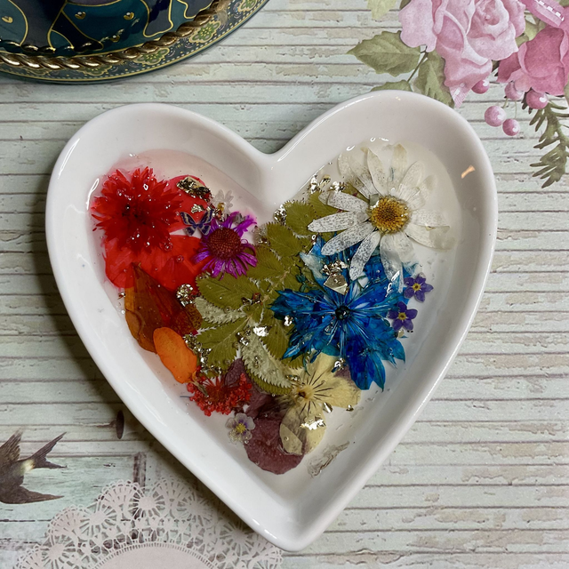 White porcelain ring trinket with pressed flowers in resin.