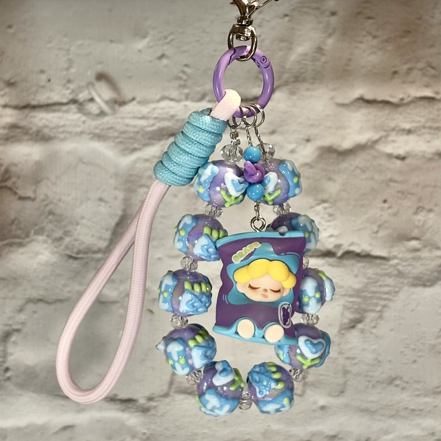 Beautiful handpainted beaded keychain with authentic doll figure in turquoise/purple design