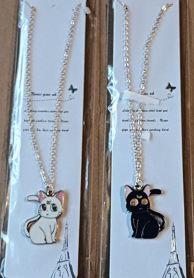 Sailor Moon Artemis and Luna Pendant Necklaces.