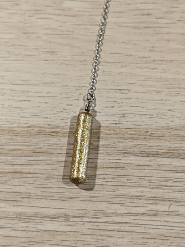 Pendule baton - doré