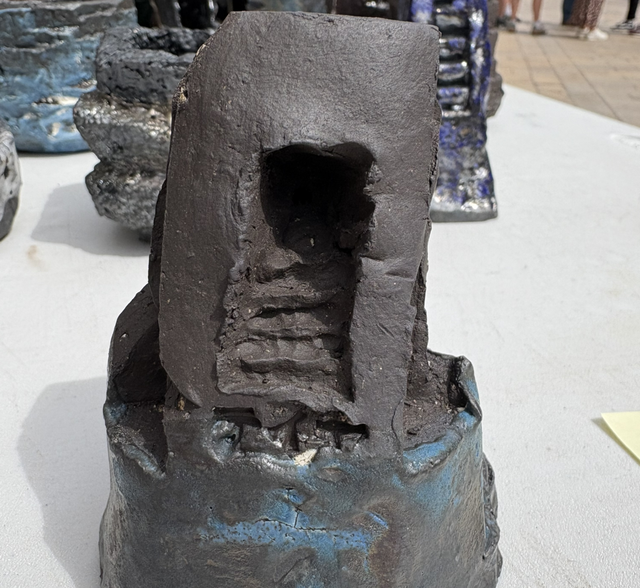 Untitled black ceramic small sculpture with blue glaze