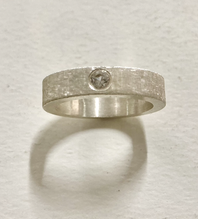 Silver band florentine engraving with white cubic zirconia