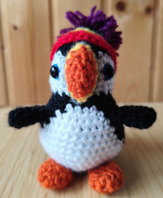 Fluffy the puffin with rainbow hat, small size (made from merino wool yarn)