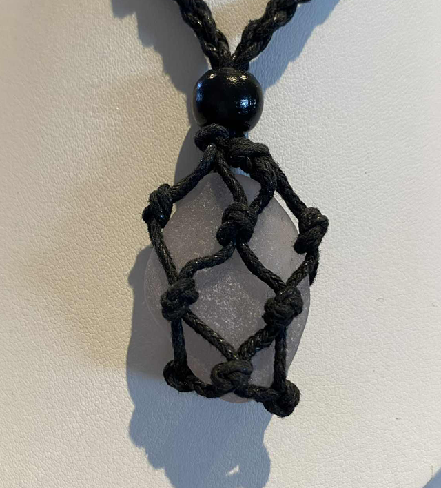 Adjustable necklace containing pinkish sea glass