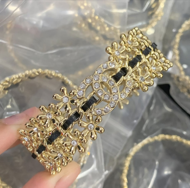 Bracelets CH doré avec bandes noirs 