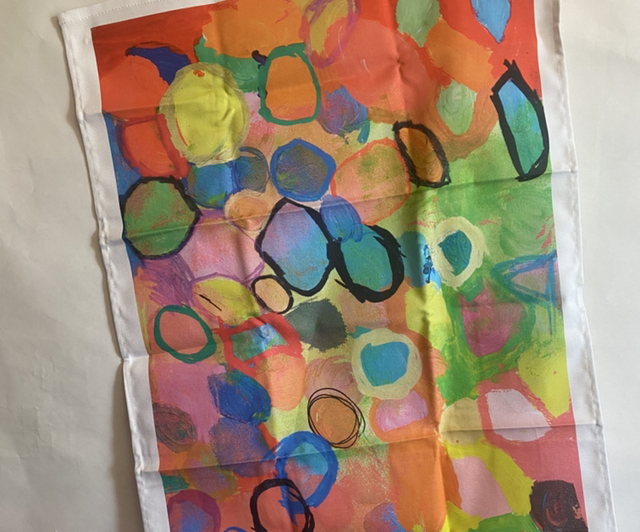 Tea Towel - cotton with ‘Orange circles’ print by Beth, packaged with belly band ideal for a gift. 