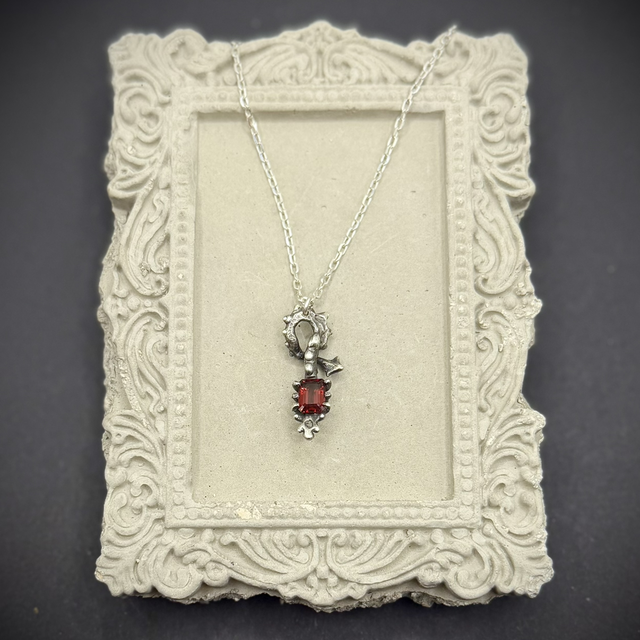 Garnet Skeletal Form pendant necklace