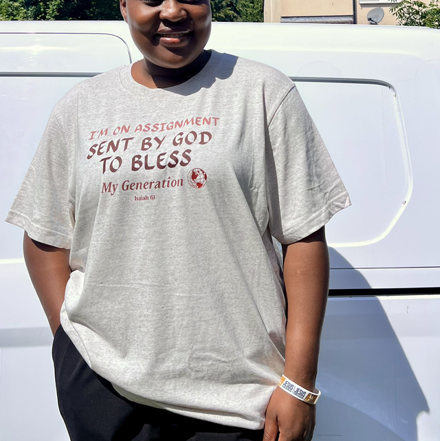 Manna Mocha – “On Assignment” Faith T-Shirt (Unisex, Tan Brown)