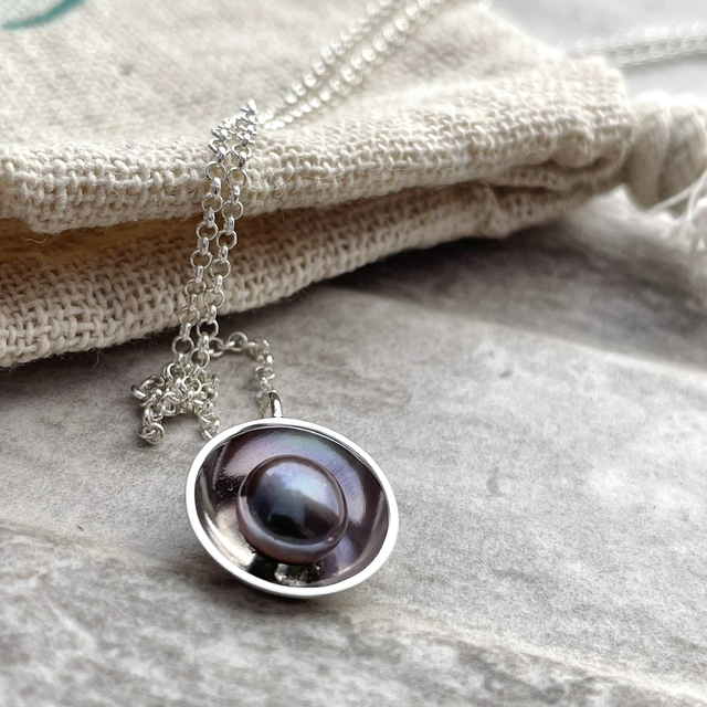 Peacock Pearl in a Silver Dome 