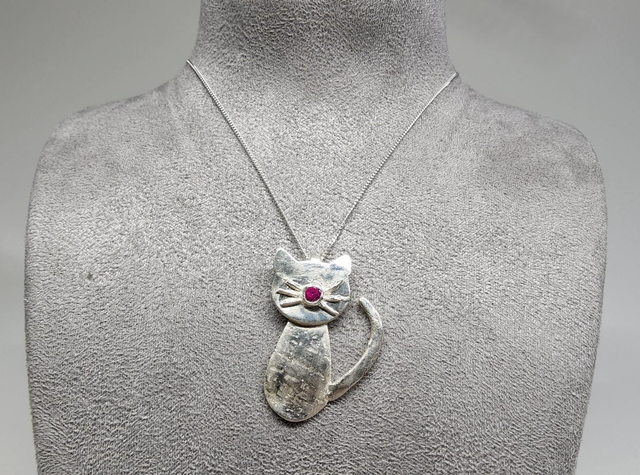 Cat pendant with fuchsia cubic zirconia on silver necklace