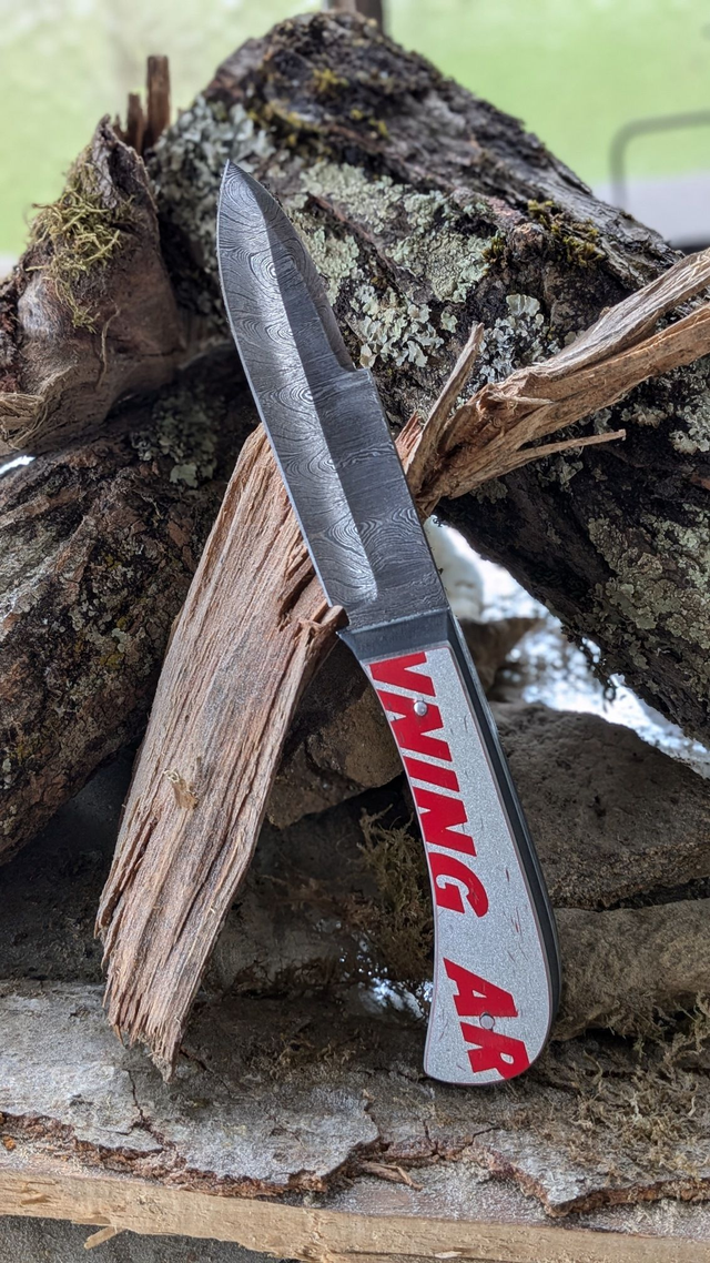 Couteau fixe - Le Damas qui glisse