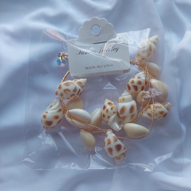 Pulsera conchas