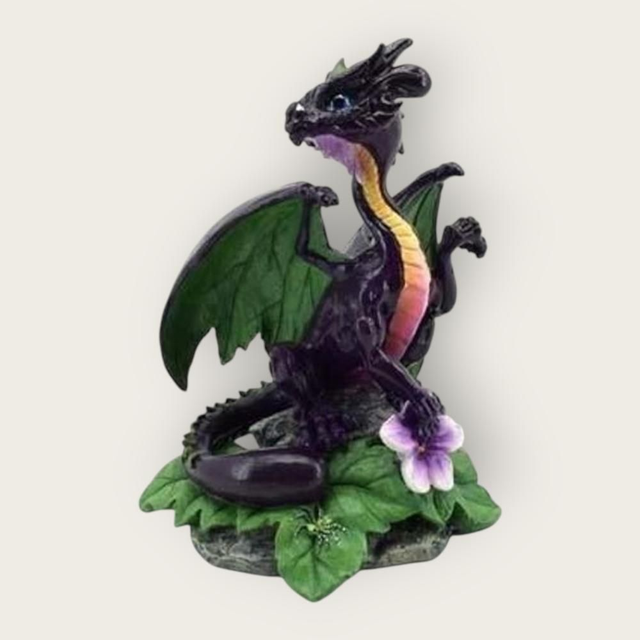 Dragon violet tenant une fleur