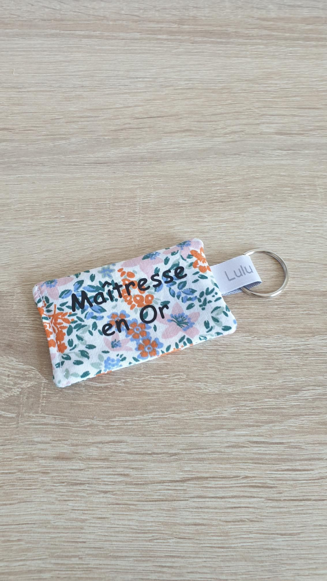 Porte clés Maîtresse en Or (fleuri orange)