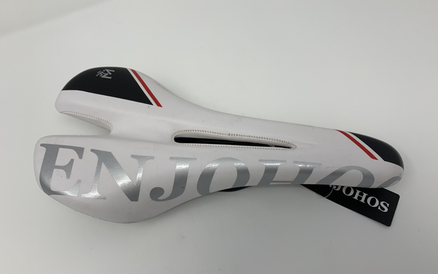 Bike saddle generic make with writing &amp; black &amp; white saddle 