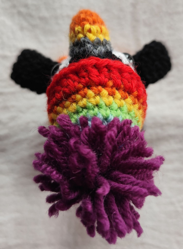 Fluffy the puffin with rainbow hat, small size (made from merino wool yarn)