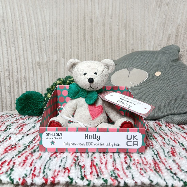 Holly. Small size, handmade teddy bear. UKCA. Tray base packaging. Standard Wool Felt. Traditional. Beige. Emerald green. Christmas red. Sorbet pink.