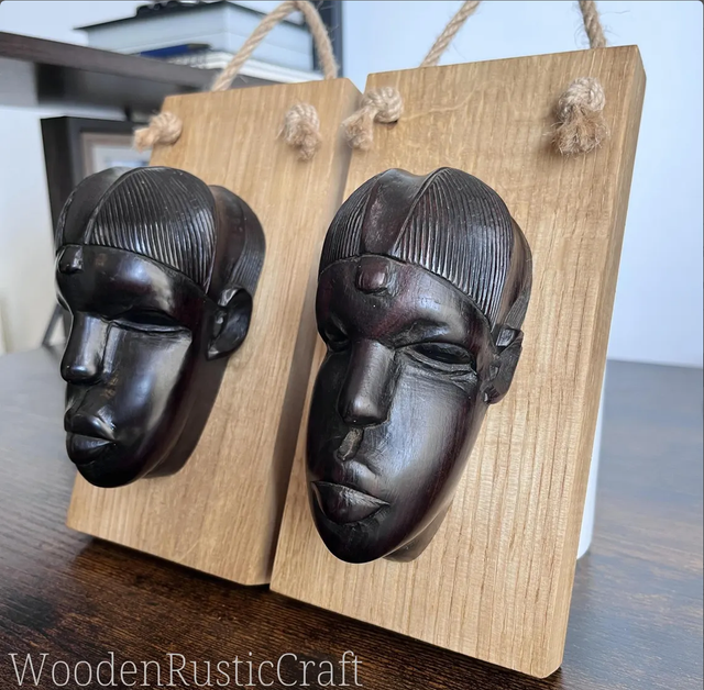 Pair of Ebony Head Sculptures on Oak Wall-Mounting Bases