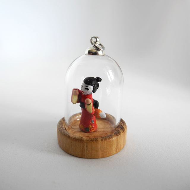 Kitsune disguised as Geisha in a Kimono adorned with autumn leaves - miniature pendant for Japan enthusiasts