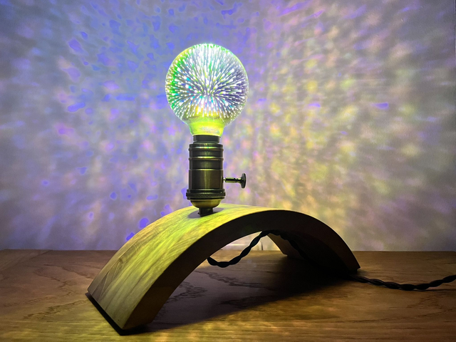Decorative lamp made of Paulownia wood with a 3D light bulb.