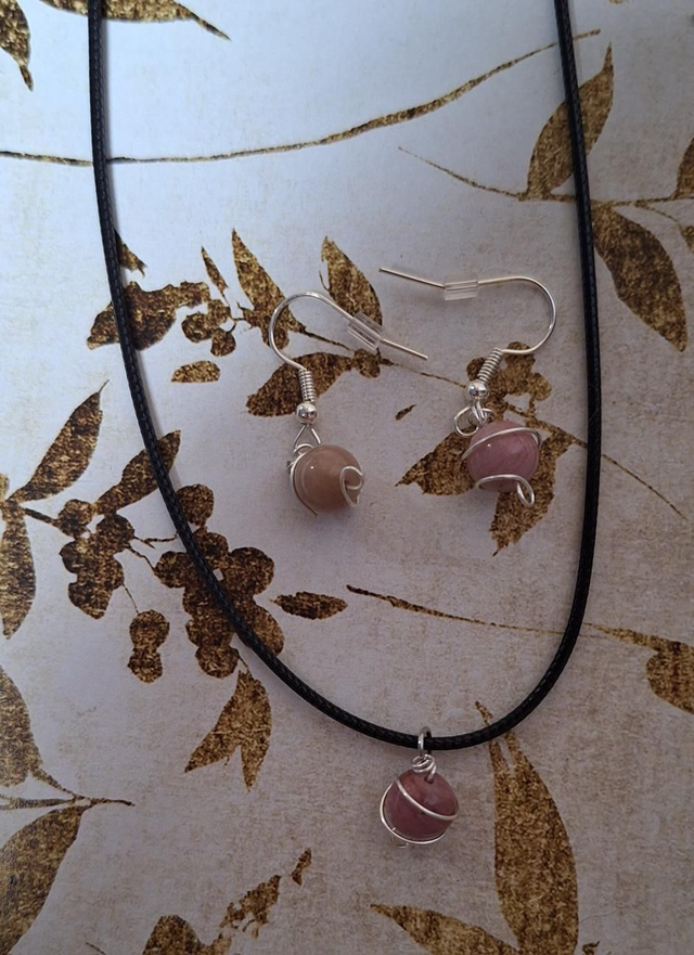 Planetary lovers set in silver with Rhodonite