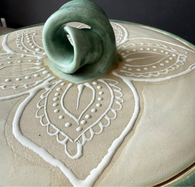 Small stoneware bread crock with hand-painted mandala patterns