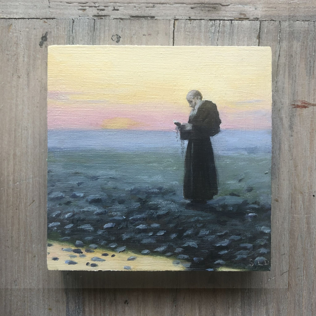 Moine priant au coucher du soleil