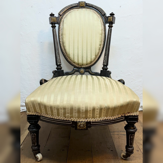 A 19th Century Victorian Ebonised Nursing Chair With Cream And Gold Striped Upholstery
