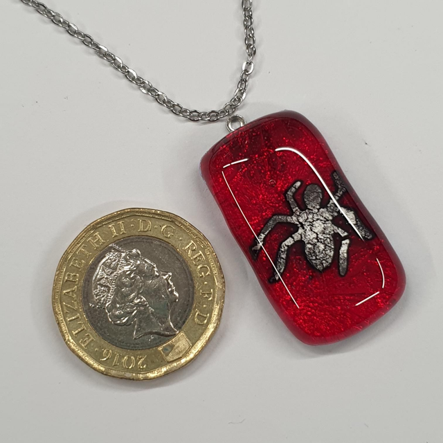 Red and silver spider pendant 