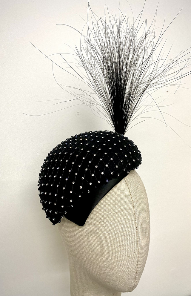 Black fur felt with duchesse satin headpiece trimmed with feather mount and Swarovski crystals