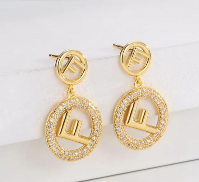 Boucles d'oreilles FD doré avec strass 