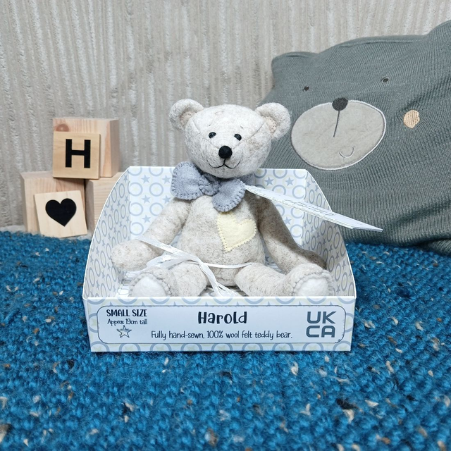 Harold. Small size, handmade teddy bear. UKCA. Tray base packaging. Standard Wool Felt. Traditional. Beige. Grey. White. Pastel Yellow.