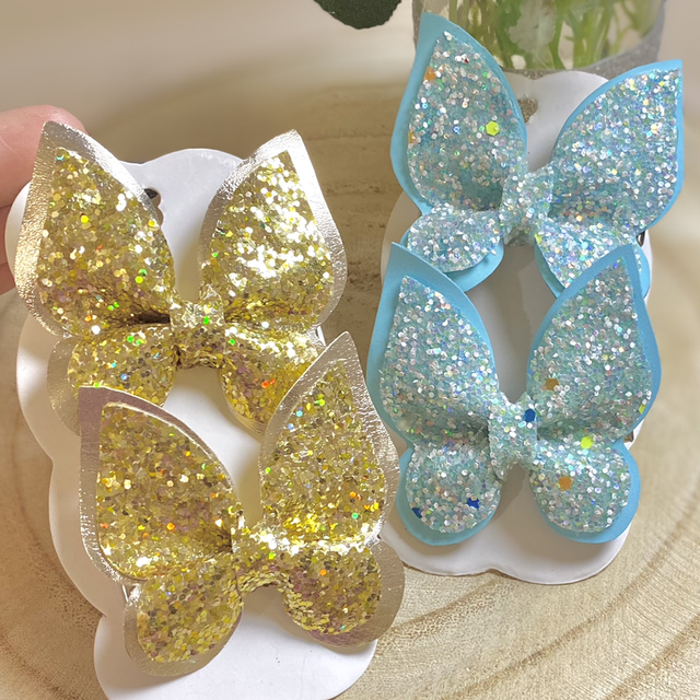 Paire de barrettes pailletée pappillon 