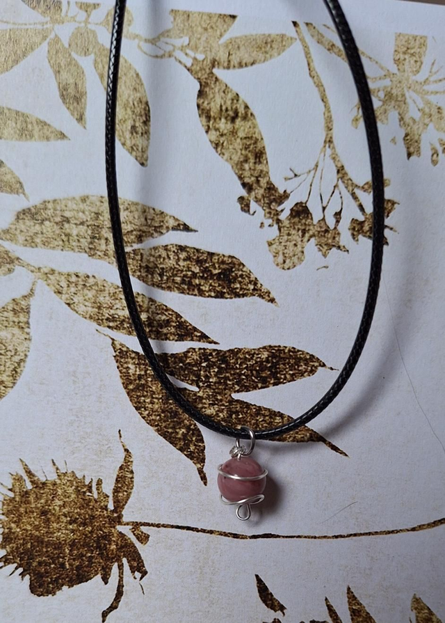 Planetary lovers set in silver with Rhodonite