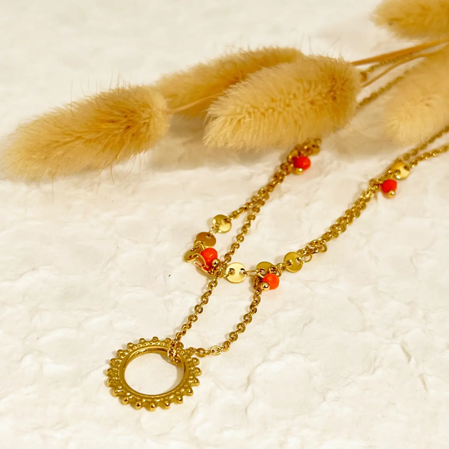 Collier double chaîne dorée avec pendentif soleil et cristaux orange