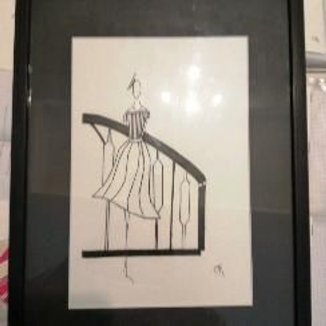 Robe cousue main encadree