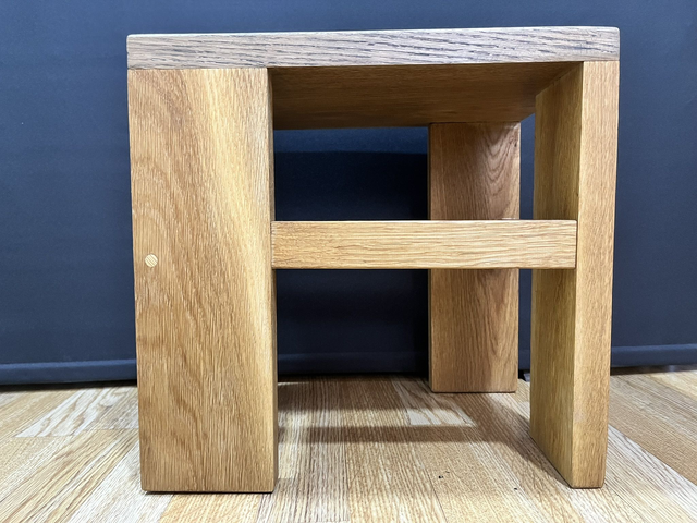 Oak cantilever stool made of solid oak wood in two colors.