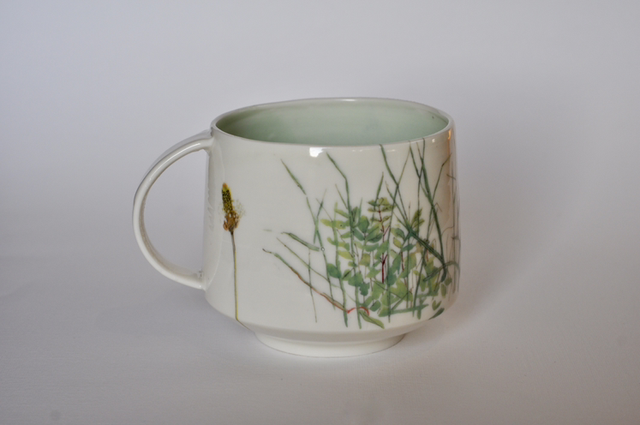 Porcelain cup with illustrated scene