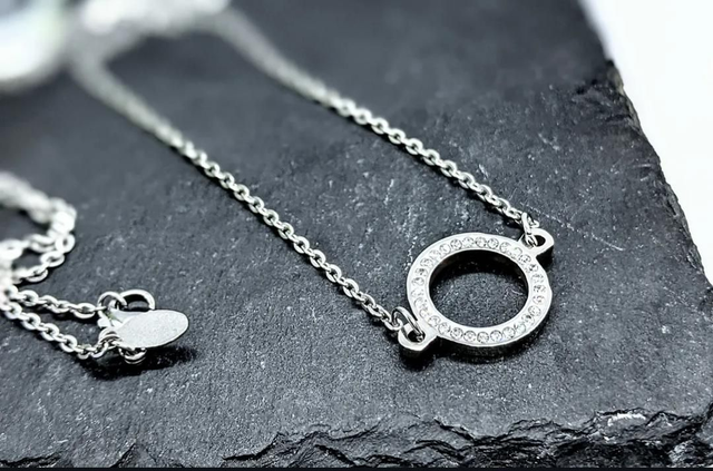 Stainless Steel Necklace with Diamanté Ring Pendant.