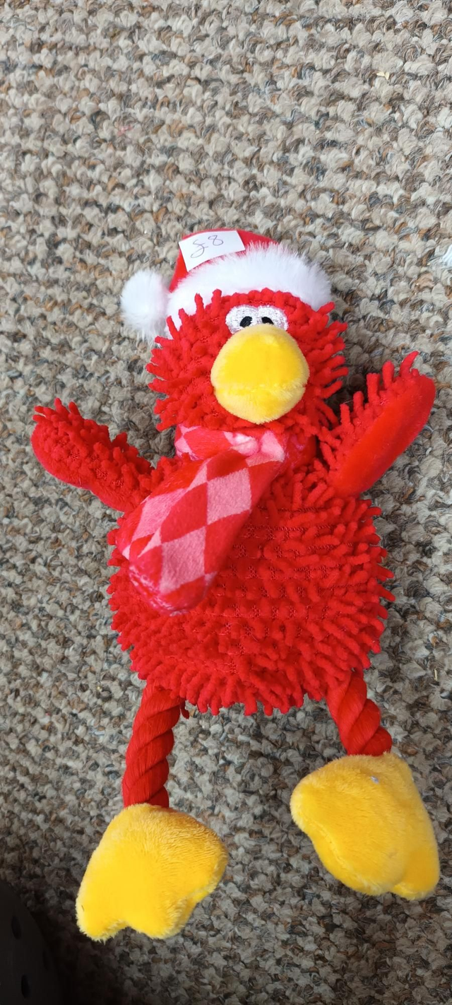 Small red sqeaky bird with rope legs 