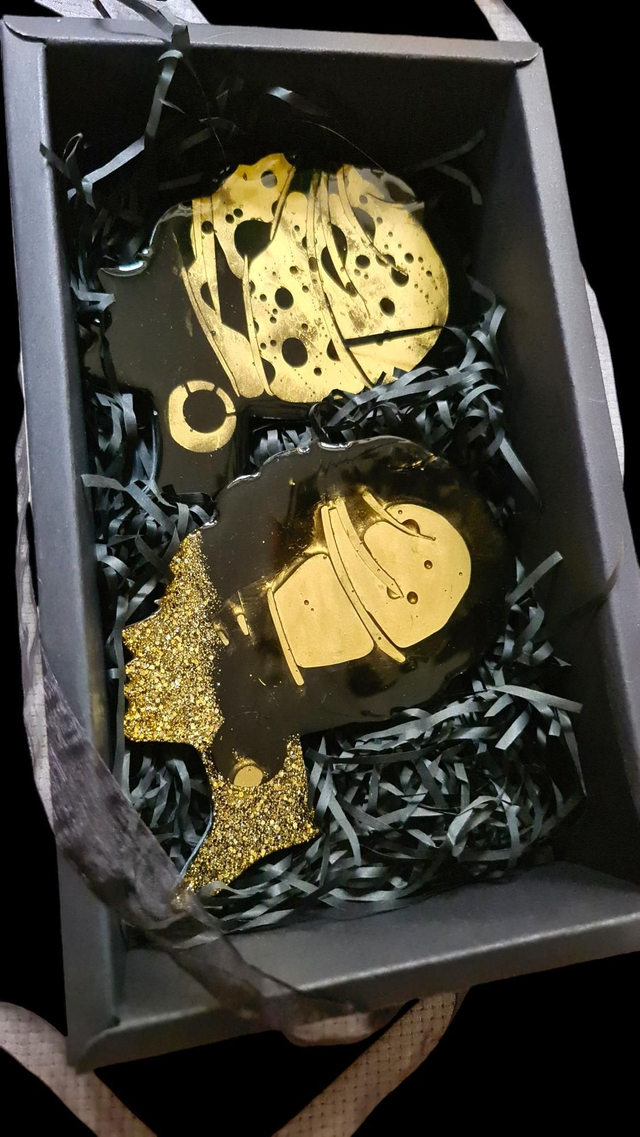 Set of 2 black and gold coasters