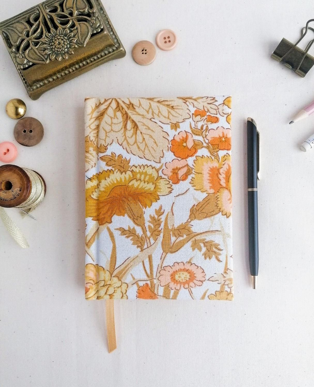 2025 hardback pocket A6 Diary with Orange retro floral fabric. Page a day view.