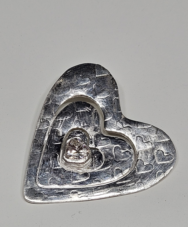 Large heart pendant with clear heart shaped cubic zirconia