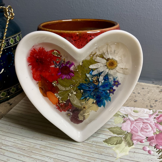 White porcelain ring trinket with pressed flowers in resin.